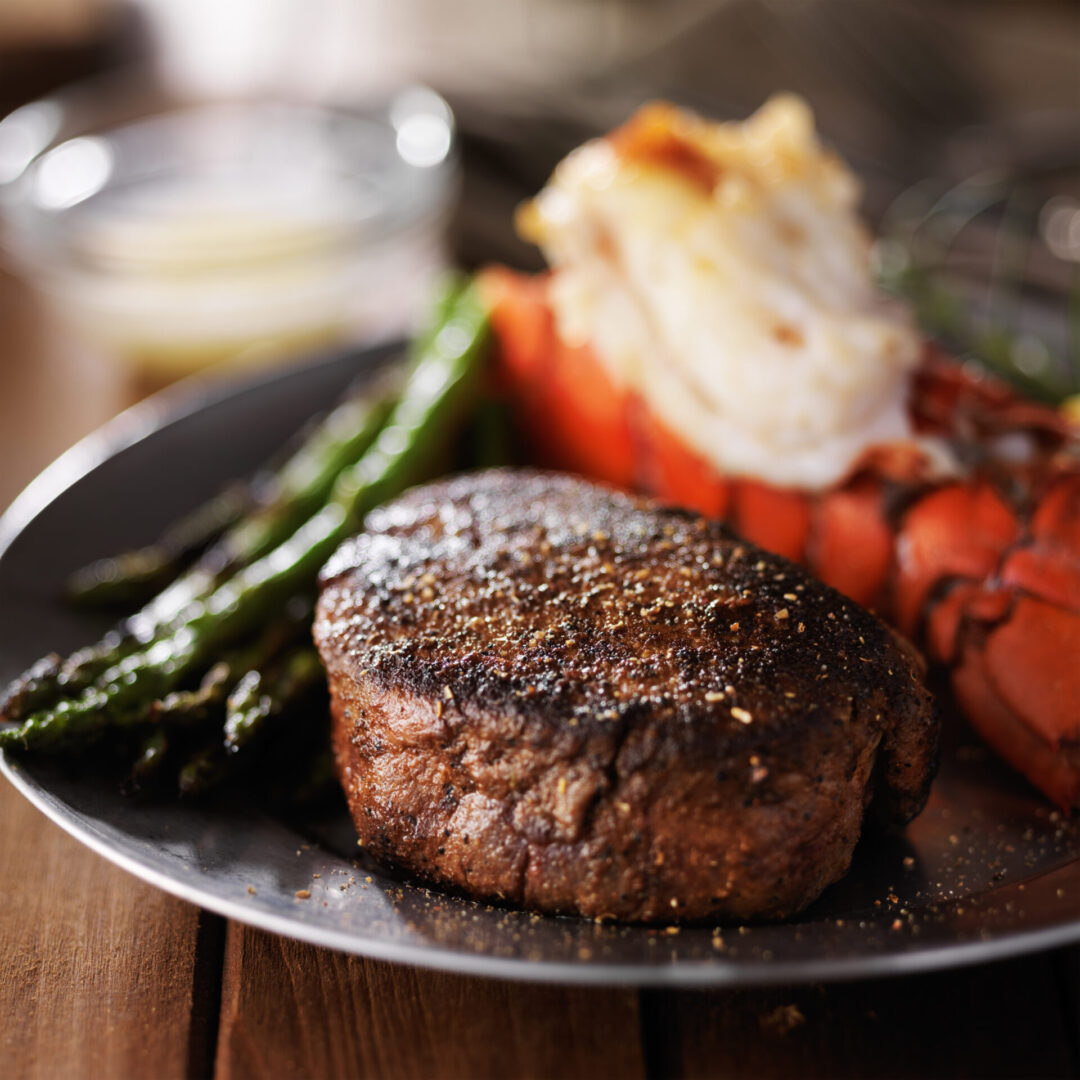 lobster tail and filet mignon dinner with asparagus